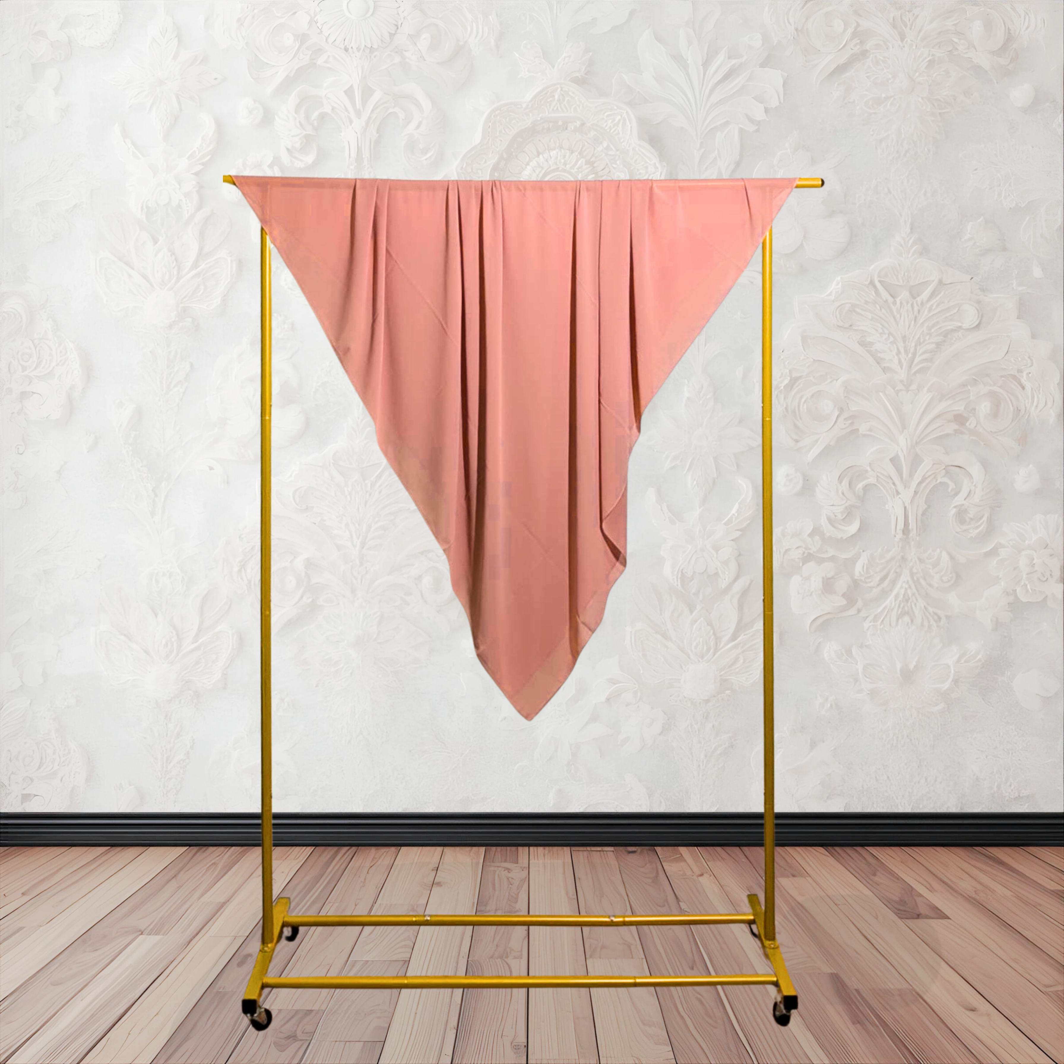 Yellow garment rack with a pink cloth draped over it against a white wall. chiffon hijab