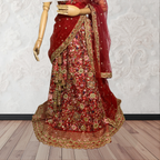 This exquisite red lehenga choli crafted from luxurious raw silk showcases intricate resham, zardosi, beads, sequins, and cut dana floral embroidery. The heavily embellished hemline and delicate cream butti accents enhance its sophisticated charm. Complete with a matching embroidered net dupatta featuring floral buttis and an elegant border, and a stitched blouse piece adorned with coordinating floral motifs, for wedding and bridal, pakistani, bangladeshi, indian, sri lankan.