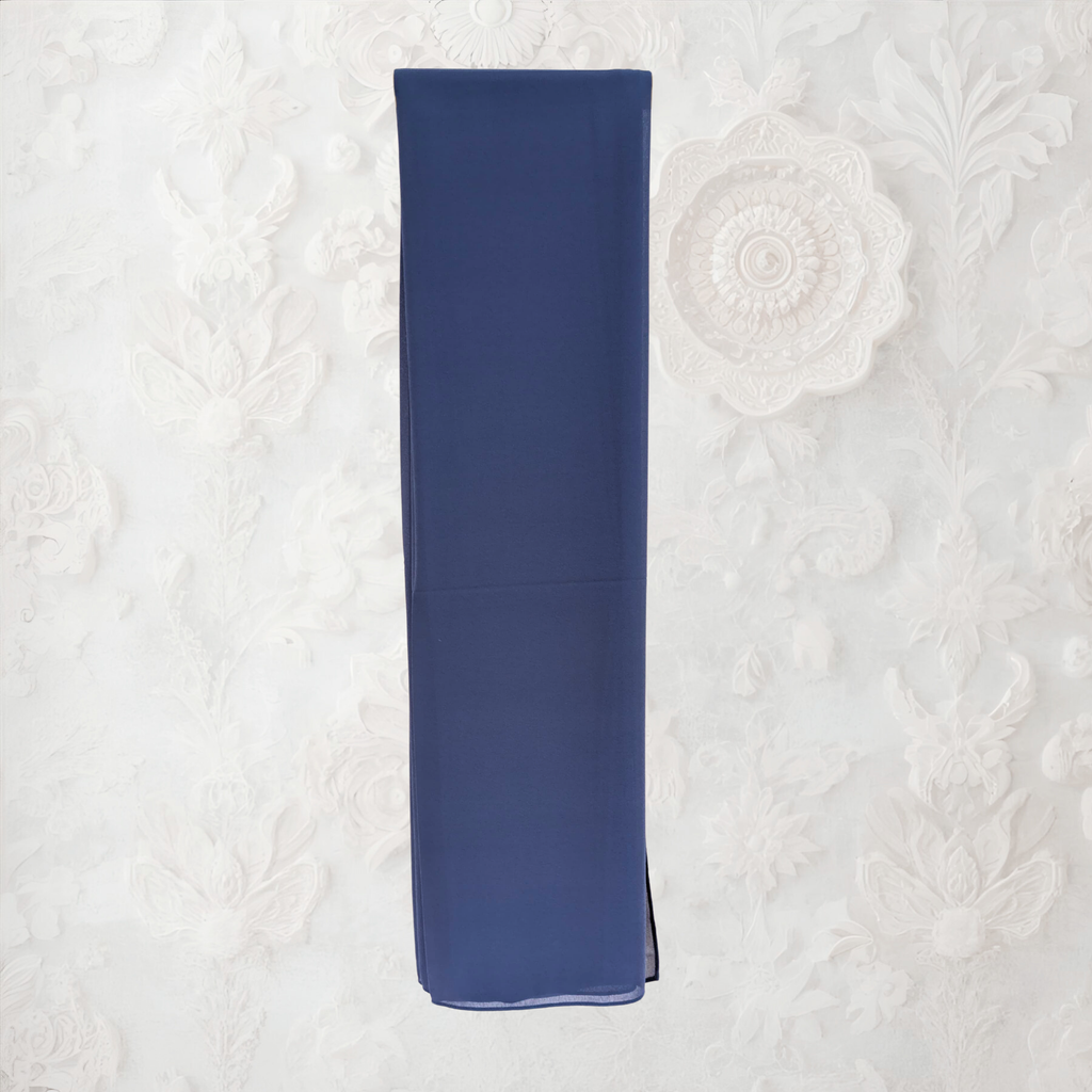 Blue napkin on a textured white surface