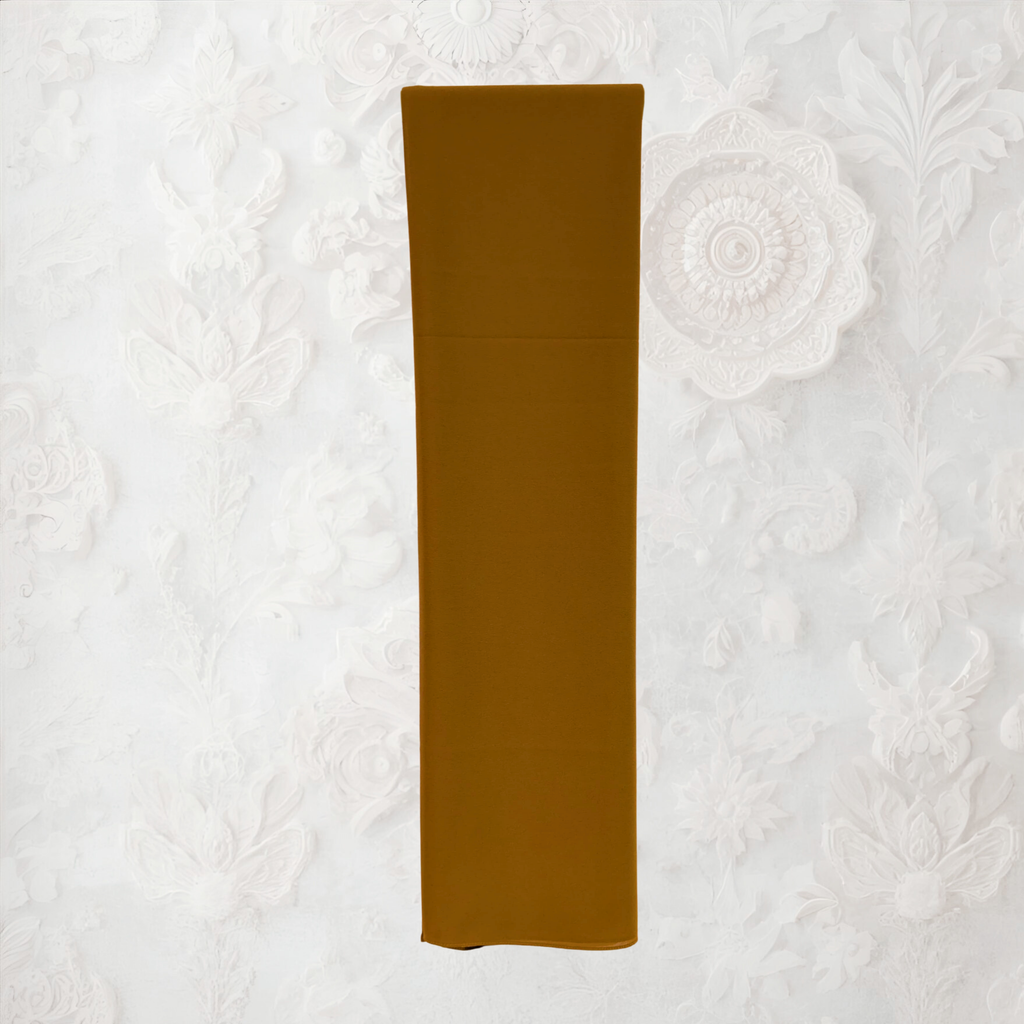 Folded pink fabric on a textured white background chiffon hijab