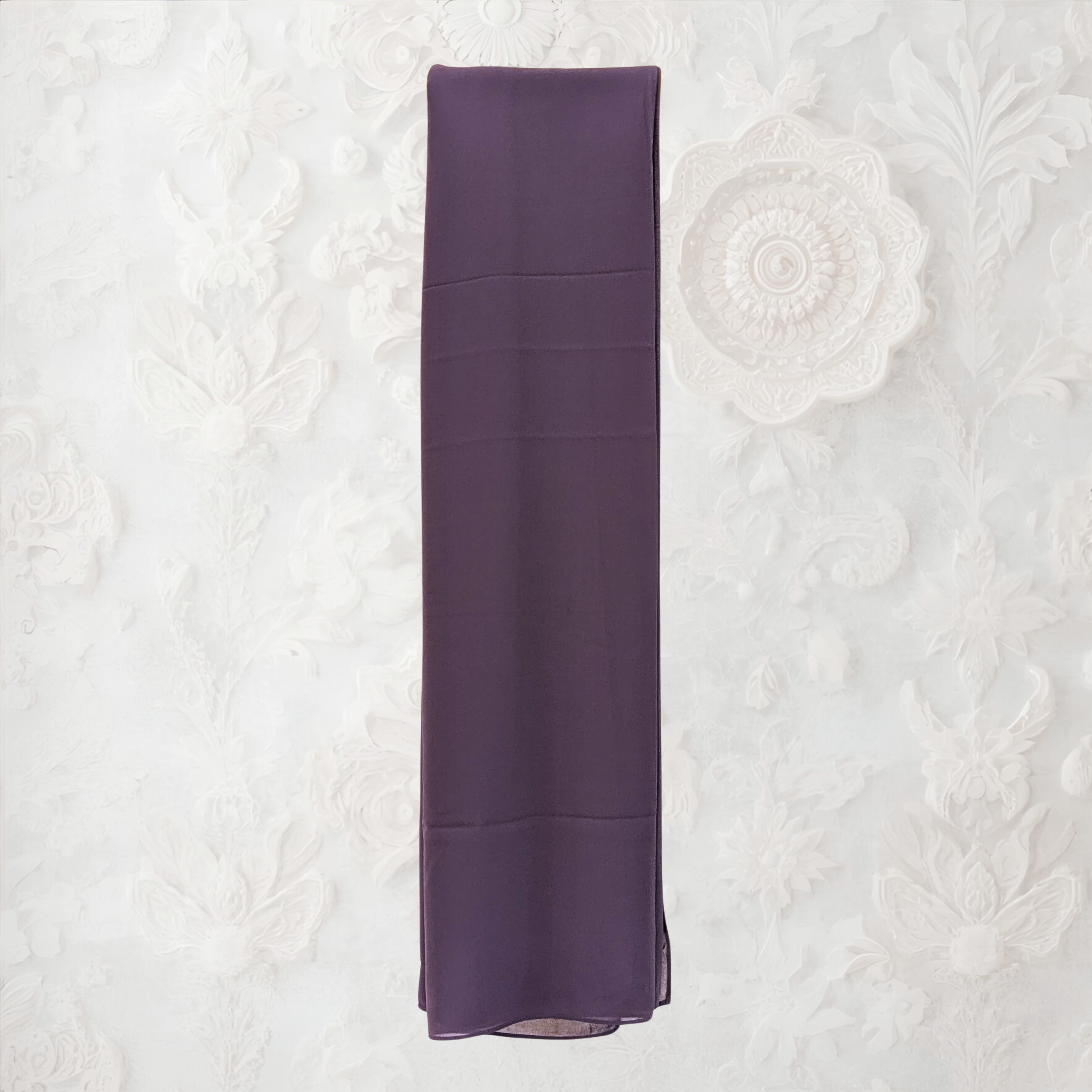 Purple scarf on a textured white background
