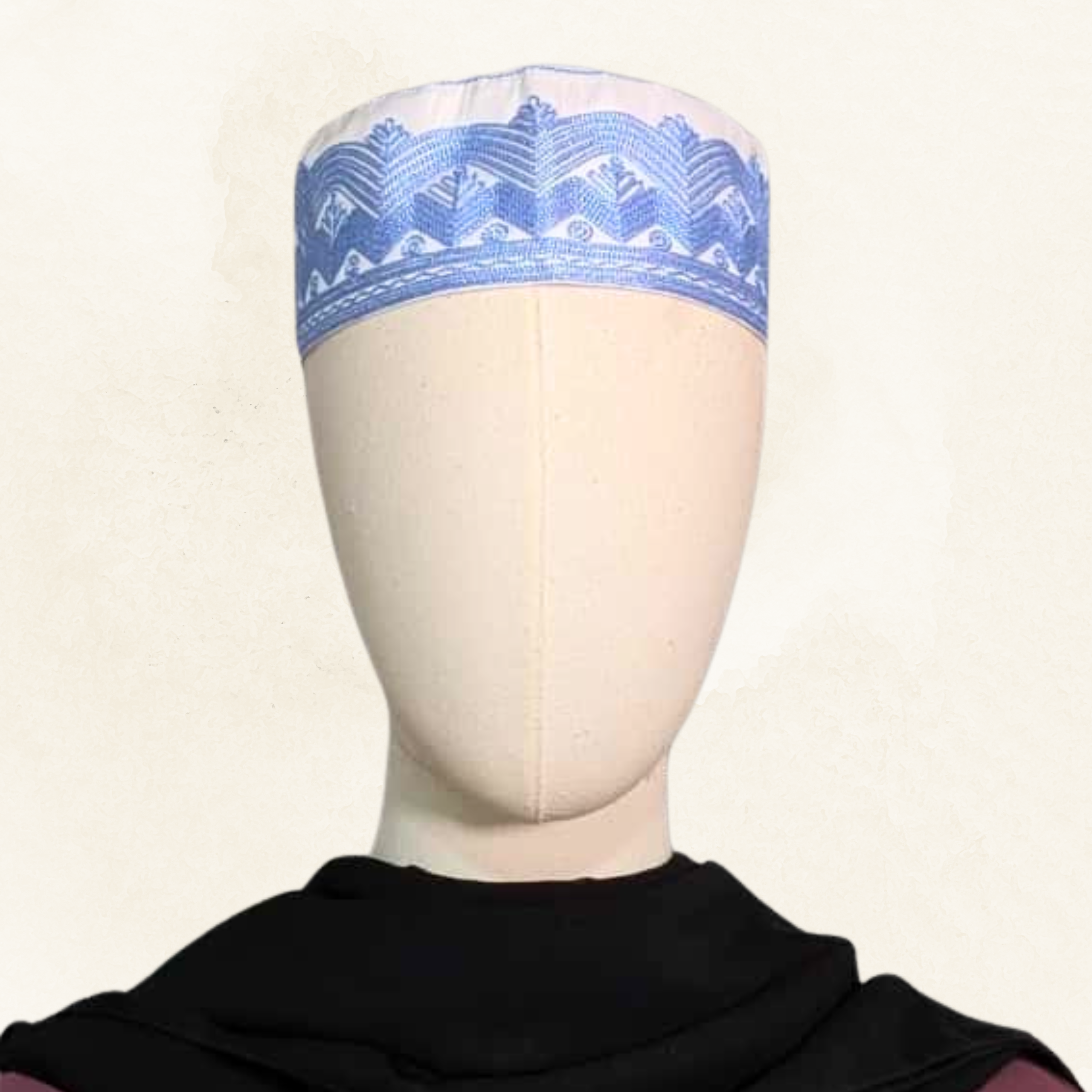 Topi Kufi white with blue embroidery.