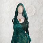 Mannequin wearing a green saree with a matching dupatta against a textured white background