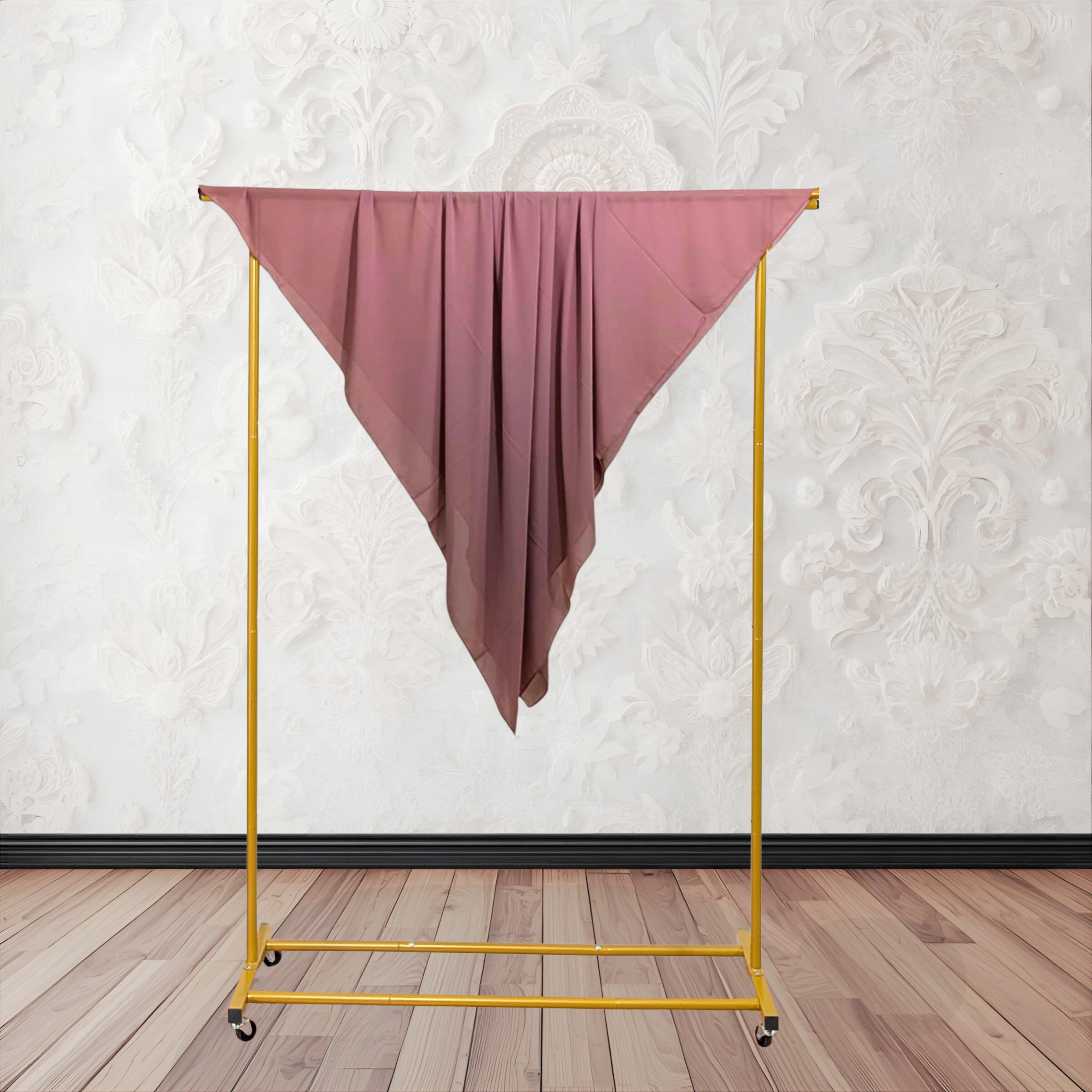 Folded pink fabric on a textured white background chiffon hijab